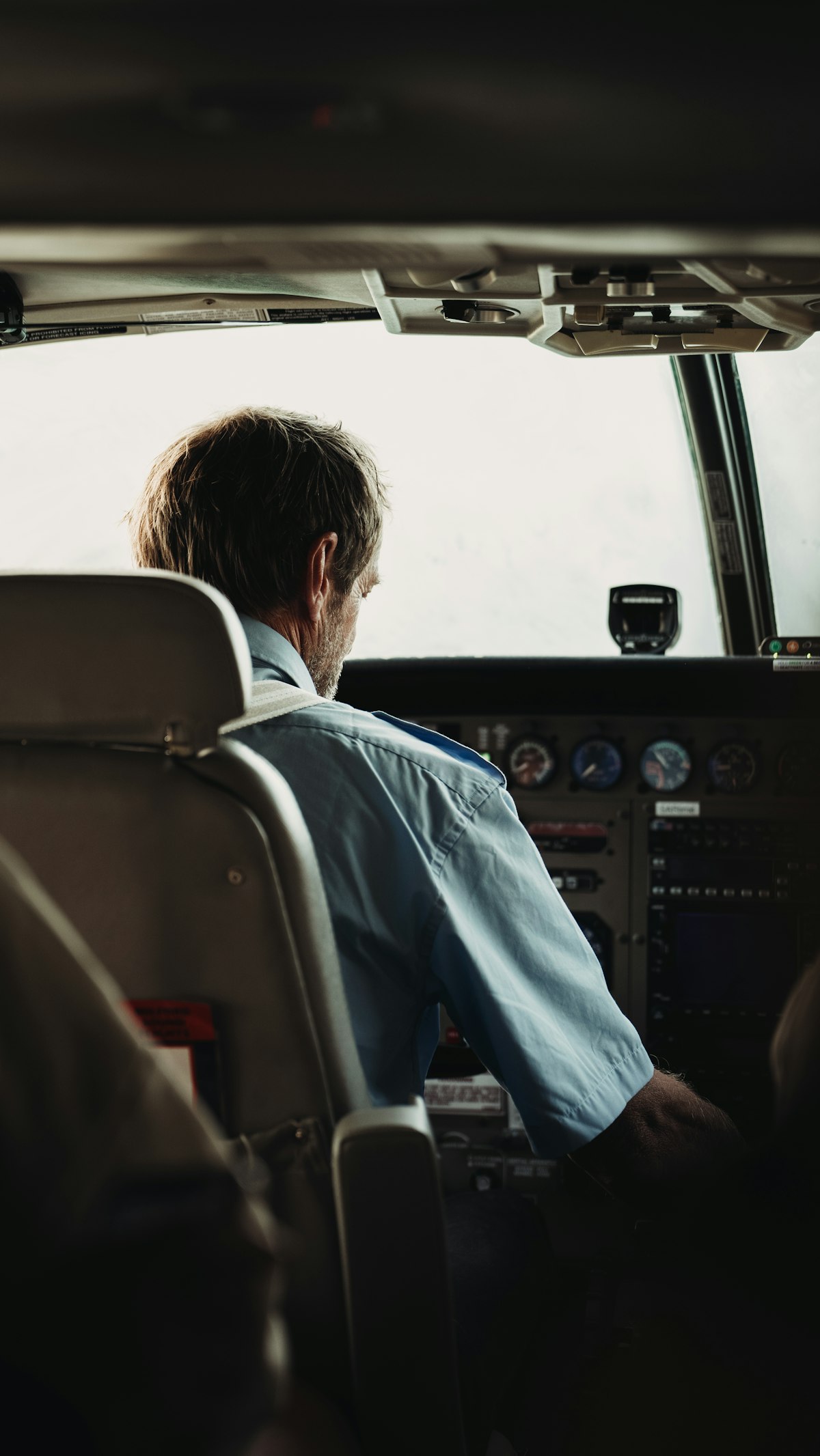 Pilot in cockpit during night flight operations